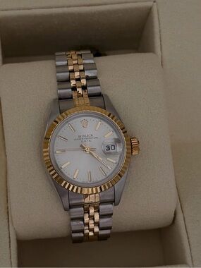 Rolex Datejust 26mm. Silver dial, fluted bezel two tone yellow gold jubilee.